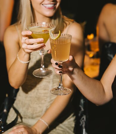 Friends cheering with drinks